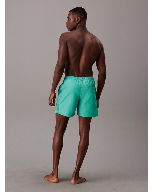 Short de bain mi-long avec cordon de serrage Calvin Klein pour homme en coloris Green