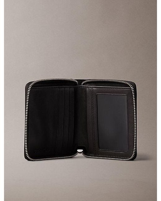 Calvin Klein Black Embossed Allover Monogram Zip Bifold Wallet for men