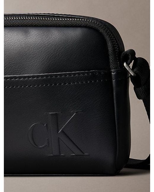 Calvin Klein Black Embossed Monogram Logo Camera Bag for men