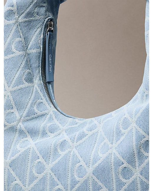Calvin Klein Blue Allover Emblem Logo Denim Crescent Bag