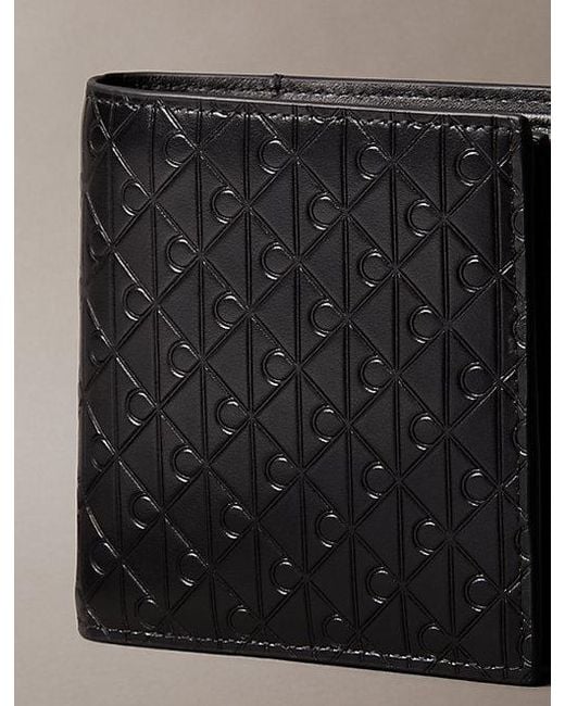 Calvin Klein Black Embossed Emblem Trifold Wallet for men
