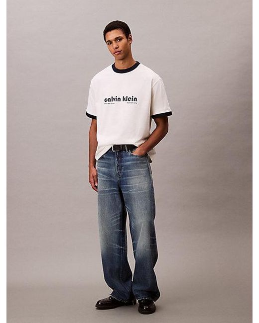Calvin Klein Blue Jeans Logo Graphic Relaxed Ringer T-Shirt for men