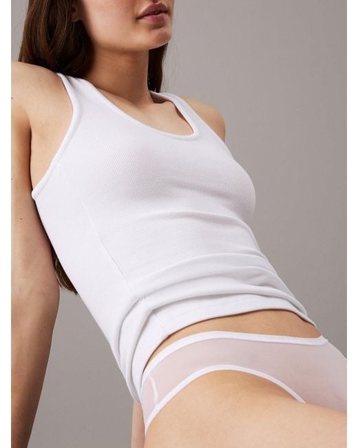 Slips brésiliens en maille transparente Calvin Klein en coloris White