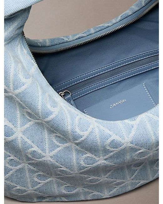 Calvin Klein Blue Allover Emblem Logo Denim Crescent Bag