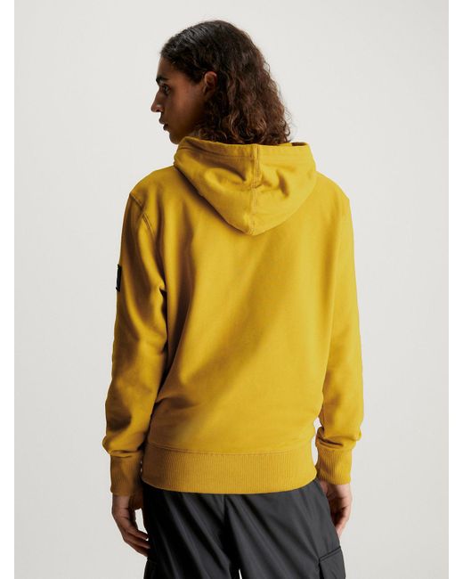 Sweat-shirt à capuche en tissu éponge de coton avec insigne Calvin Klein pour homme en coloris Yellow
