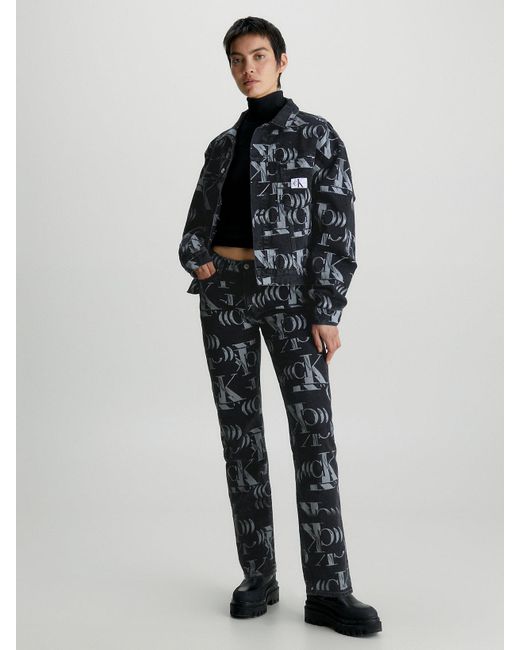 Jean droit entièrement imprimé de logos Calvin Klein en coloris Black