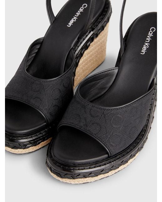 Sandales espadrilles compensées à logo Calvin Klein en coloris Black