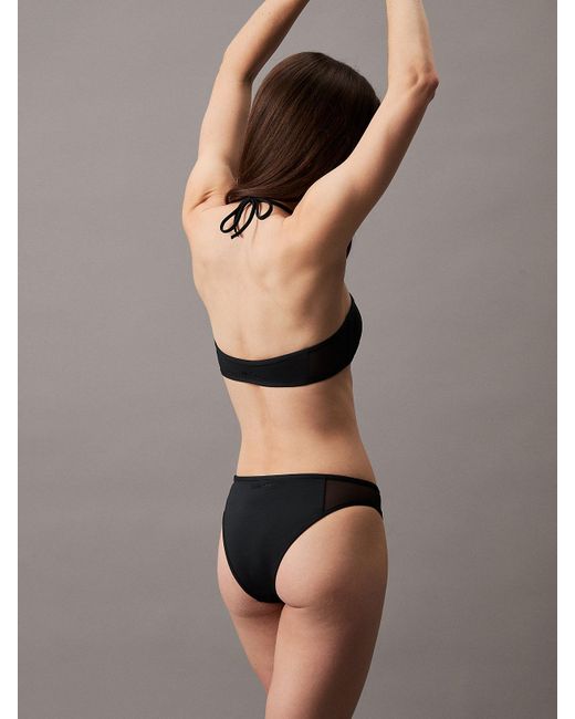 Bas de bikini avec pans transparents Calvin Klein en coloris Black
