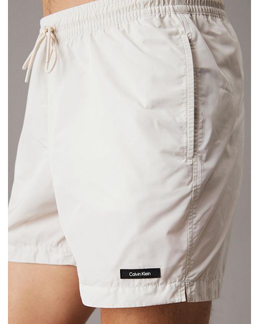 Short De Bain Mi-Long Avec Cordon De Serrage Calvin Klein pour homme en coloris White