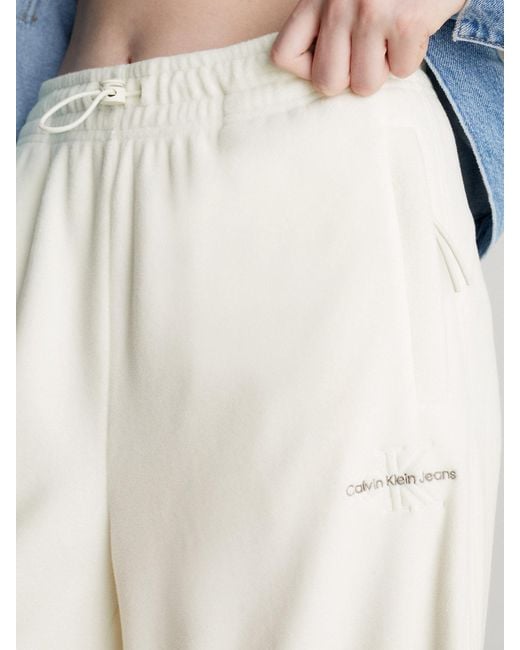 Pantalon de jogging à jambes larges en polaire Calvin Klein en coloris White