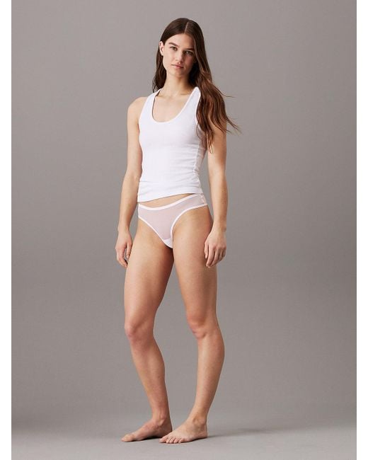 Slips brésiliens en maille transparente Calvin Klein en coloris White