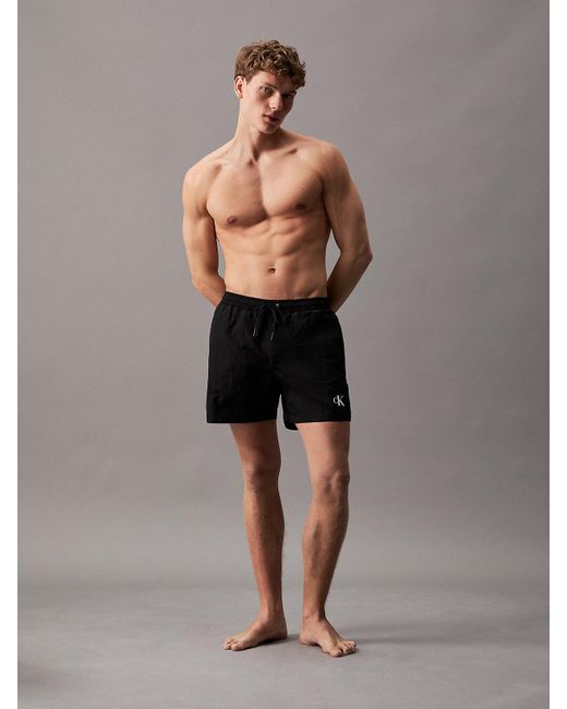 Short de bain mi-long avec cordon de serrage Calvin Klein pour homme en coloris Black