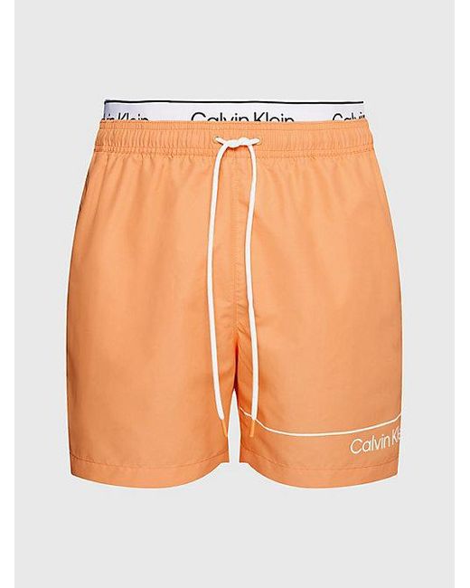 Bañador corto con cinturilla doble Calvin Klein de hombre de color Orange