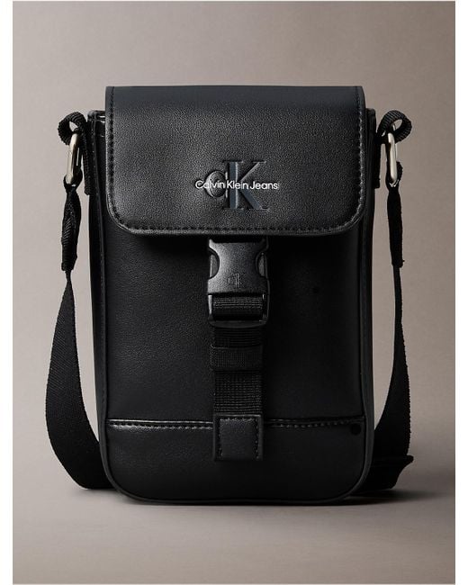 Calvin Klein Monogram Logo Flap Phone Crossbody Bag in Black