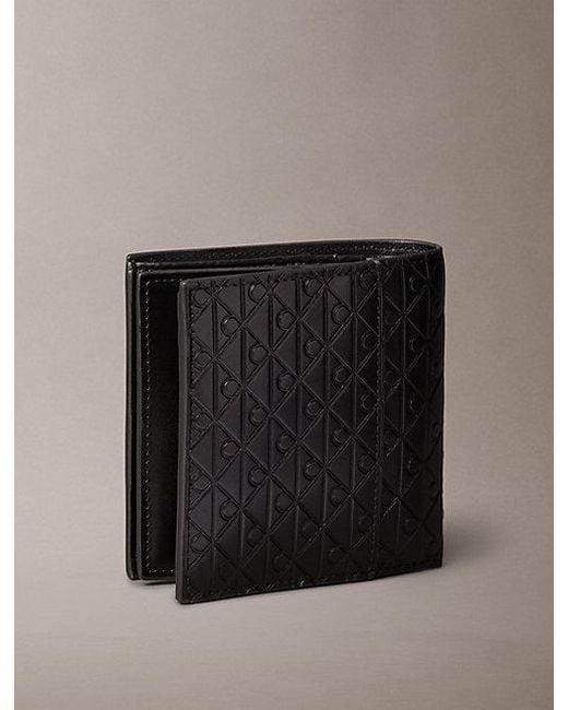 Calvin Klein Black Embossed Emblem Trifold Wallet for men