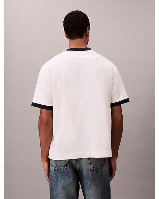 Calvin Klein Blue Jeans Logo Graphic Relaxed Ringer T-Shirt for men