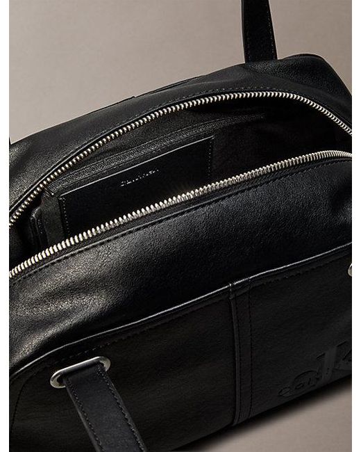 Calvin Klein Black Embossed Monologo Shoulder Bag