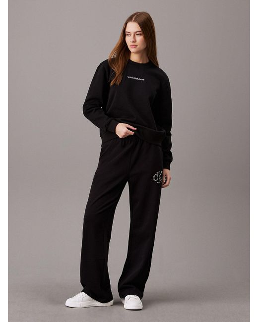 Pantalon de jogging jambe large à monogramme Calvin Klein en coloris Black