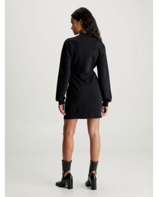 Vestido cruzado de punto de manga larga Calvin Klein de color Black