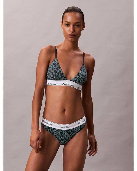 String Calvin Klein en coloris Green