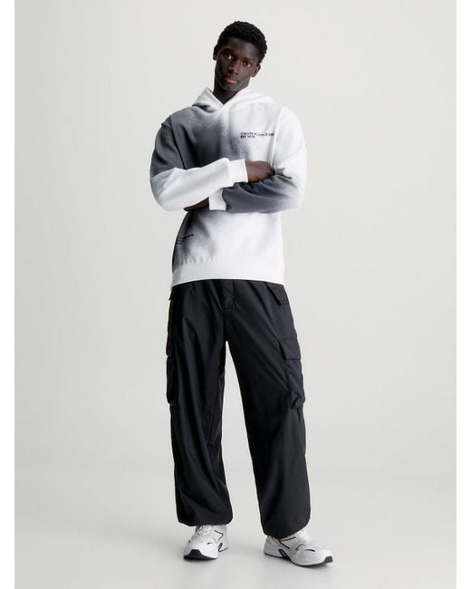 Sweat-shirt à capuche relaxed avec imprimé éclaboussures Calvin Klein pour homme en coloris White