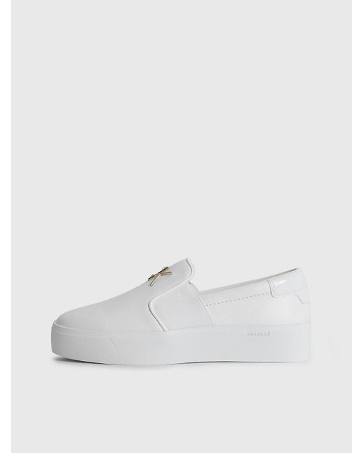 White leather store slip on shoes