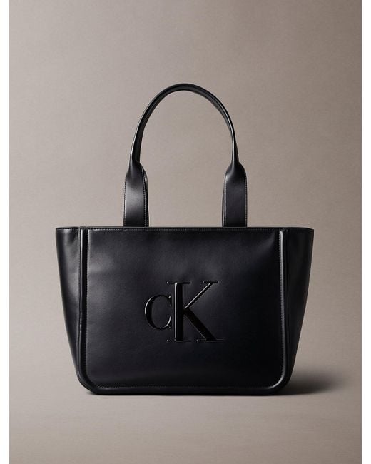 Calvin Klein Black Embossed Monogram Logo Tote Bag