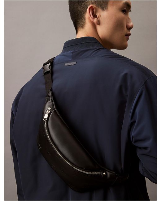 Calvin Klein Allover Monogram Logo Small Waistpack in Black Calvin Klein Allover Monogram Logo Small Waistpack in Black