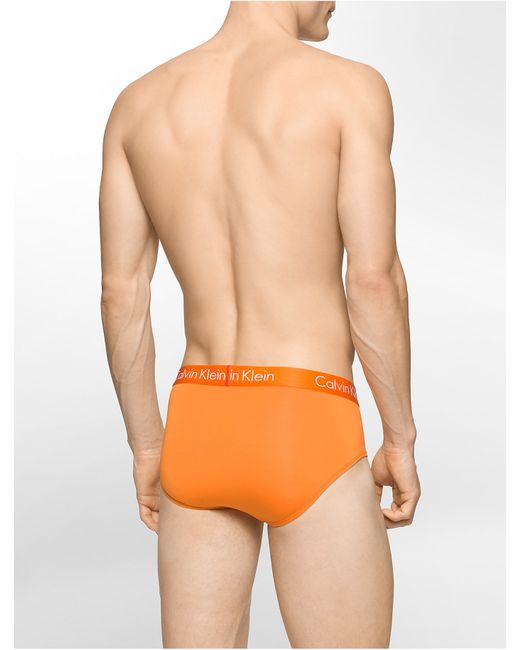 Calvin Klein Underwear Liquid Stretch Micro Hip Brief in Orange for Men |  Lyst