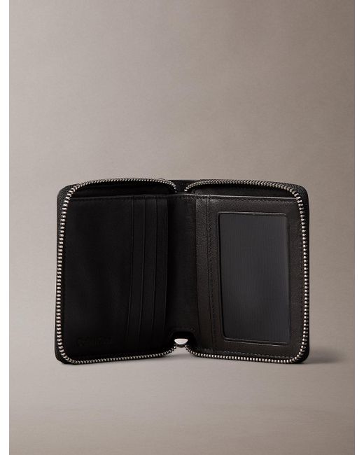 Calvin Klein Black Embossed Allover Monogram Zip Bifold Wallet for men