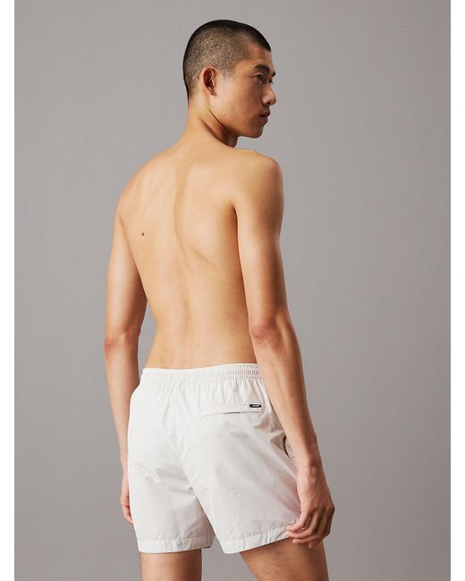 Short De Bain Mi-Long Avec Cordon De Serrage Calvin Klein pour homme en coloris White