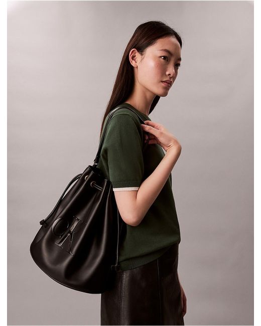 Calvin Klein Black Embossed Monogram Logo Bucket Bag