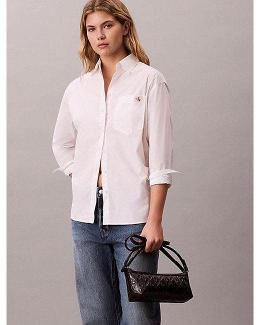 Calvin Klein Black Debossed Allover Emblem Logo Long Shoulder Bag