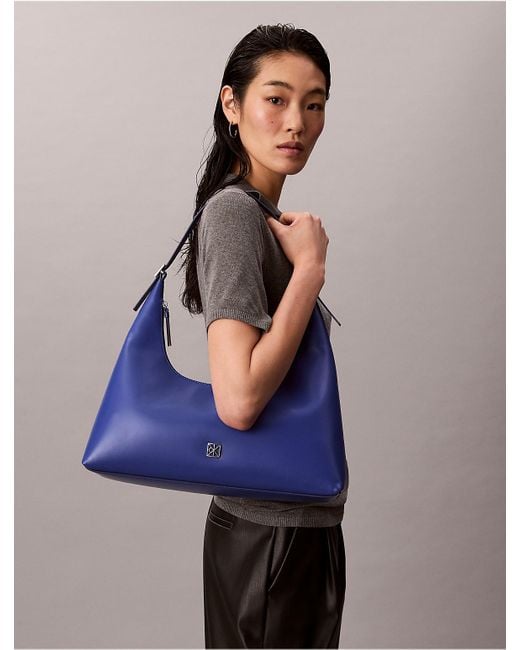 Calvin Klein Blue Monogram Logo Emblem Leather Shoulder Bag