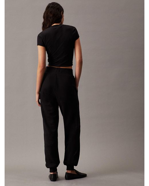 Pantalon de jogging relaxed avec monogramme Calvin Klein en coloris Black