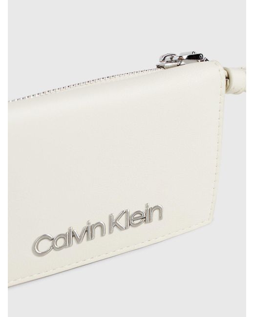 Portefeuille zippé anti-RFID avec dragonne Calvin Klein en coloris Natural