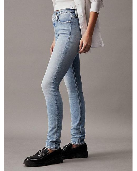 Mid Rise Skinny Jeans Calvin Klein de color Blue