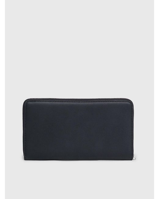 Grand portefeuille anti-RFID zippé Calvin Klein en coloris Blue