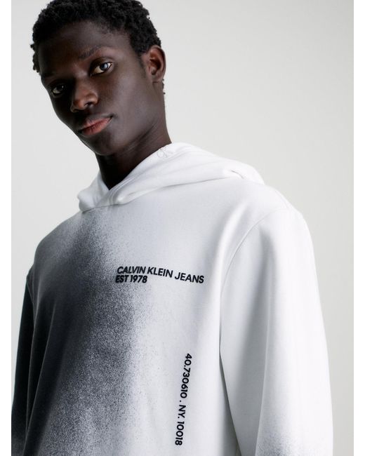 Sweat-shirt à capuche relaxed avec imprimé éclaboussures Calvin Klein pour homme en coloris White