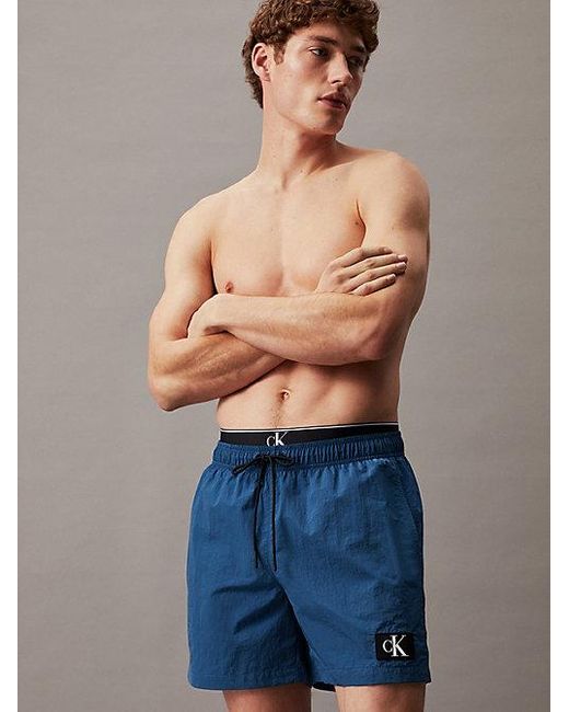 Calvin Klein Badeshorts mit doppeltem Bund - CK Monogram in Blue für Herren