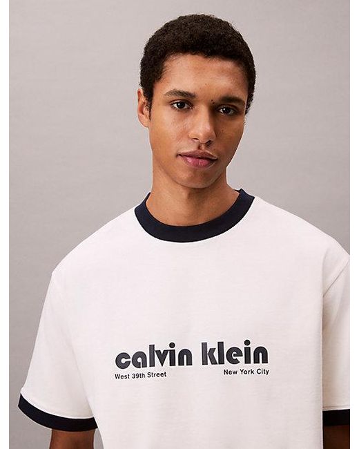 Calvin Klein Blue Jeans Logo Graphic Relaxed Ringer T-Shirt for men