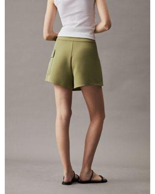 Falda pantalón cruzada de trabajo Calvin Klein de color Natural
