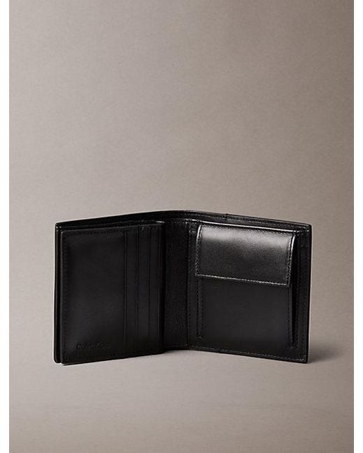 Calvin Klein Black Embossed Emblem Trifold Wallet for men