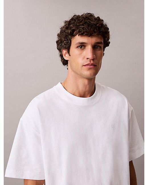 Calvin Klein Blue Jeans Oversized Embossed Logo T-Shirt for men
