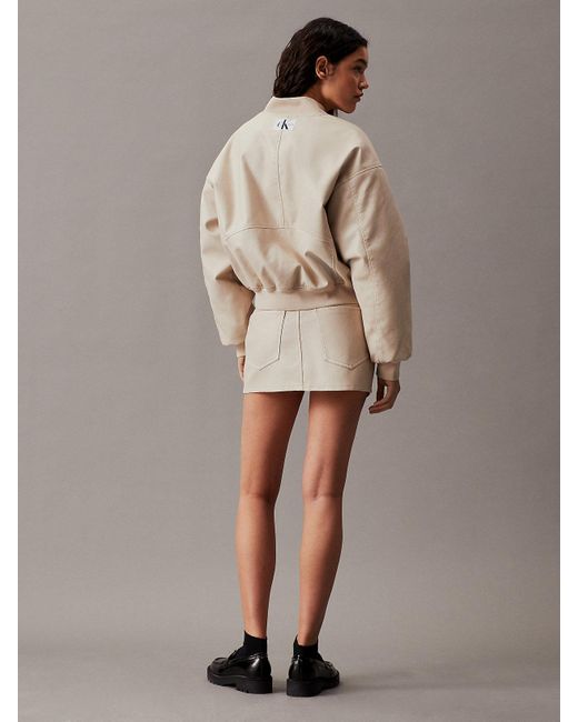 Micro-jupe en similicuir Calvin Klein en coloris Brown