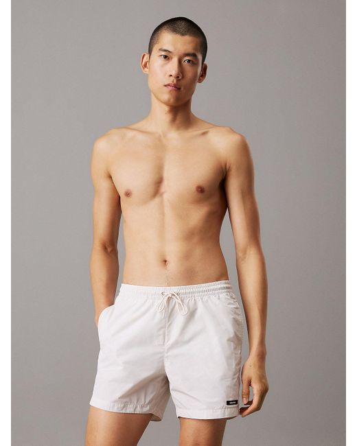 Short De Bain Mi-Long Avec Cordon De Serrage Calvin Klein pour homme en coloris White