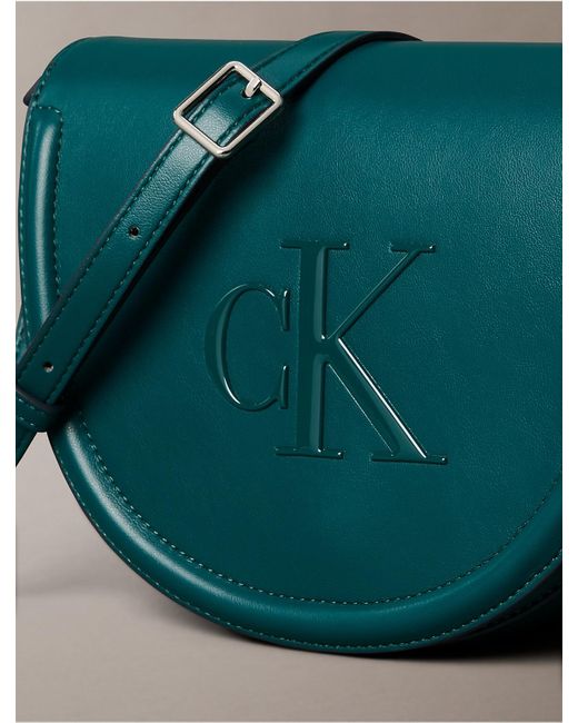 Calvin Klein Green Embossed Monogram Logo Saddle Bag