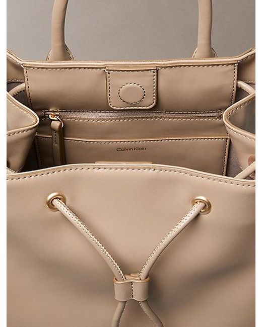 Calvin Klein Natural Monogram Drawstring Backpack