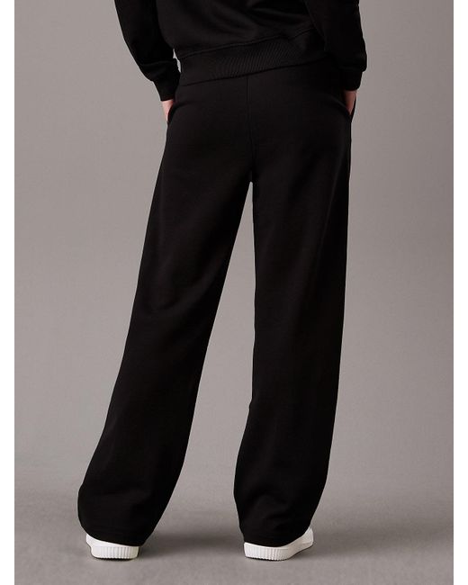 Pantalon de jogging jambe large à monogramme Calvin Klein en coloris Black