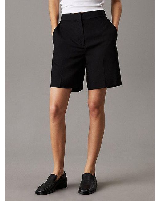 Shorts anchos de lino y lyocell Calvin Klein de color Black